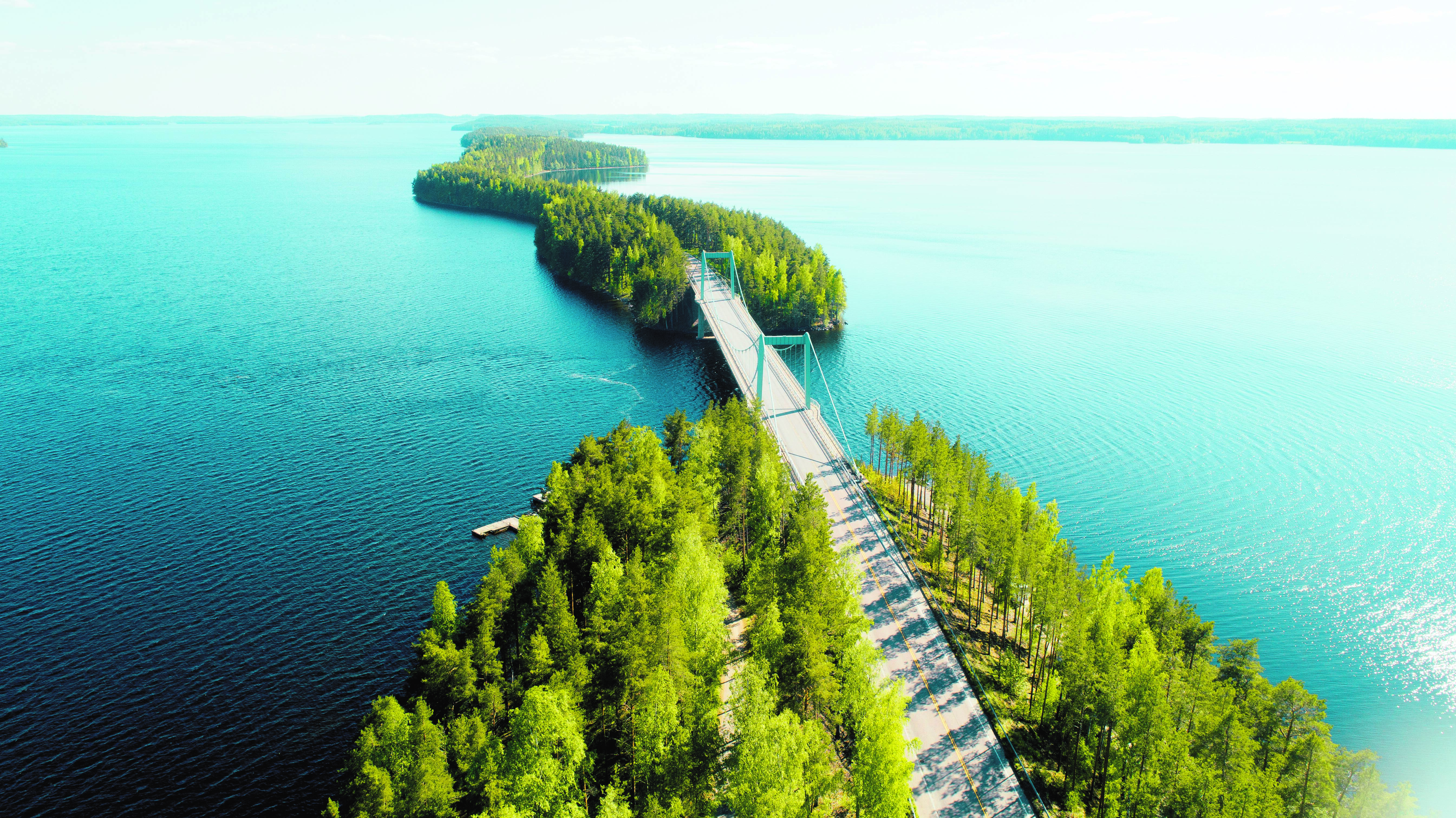an aerial view of a road bridge uniting two islands