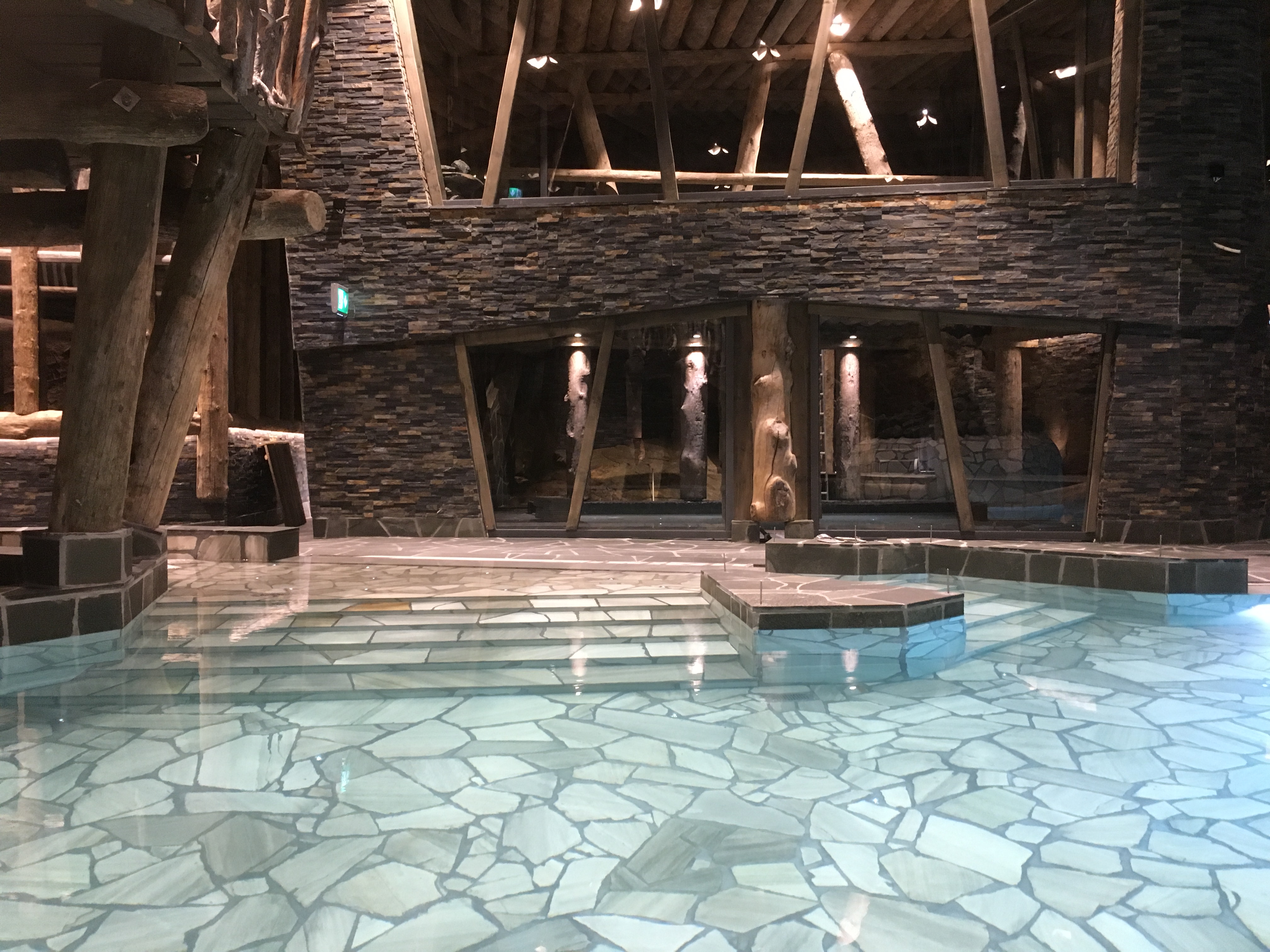 a spa interior adorned with warm wood and natural rock