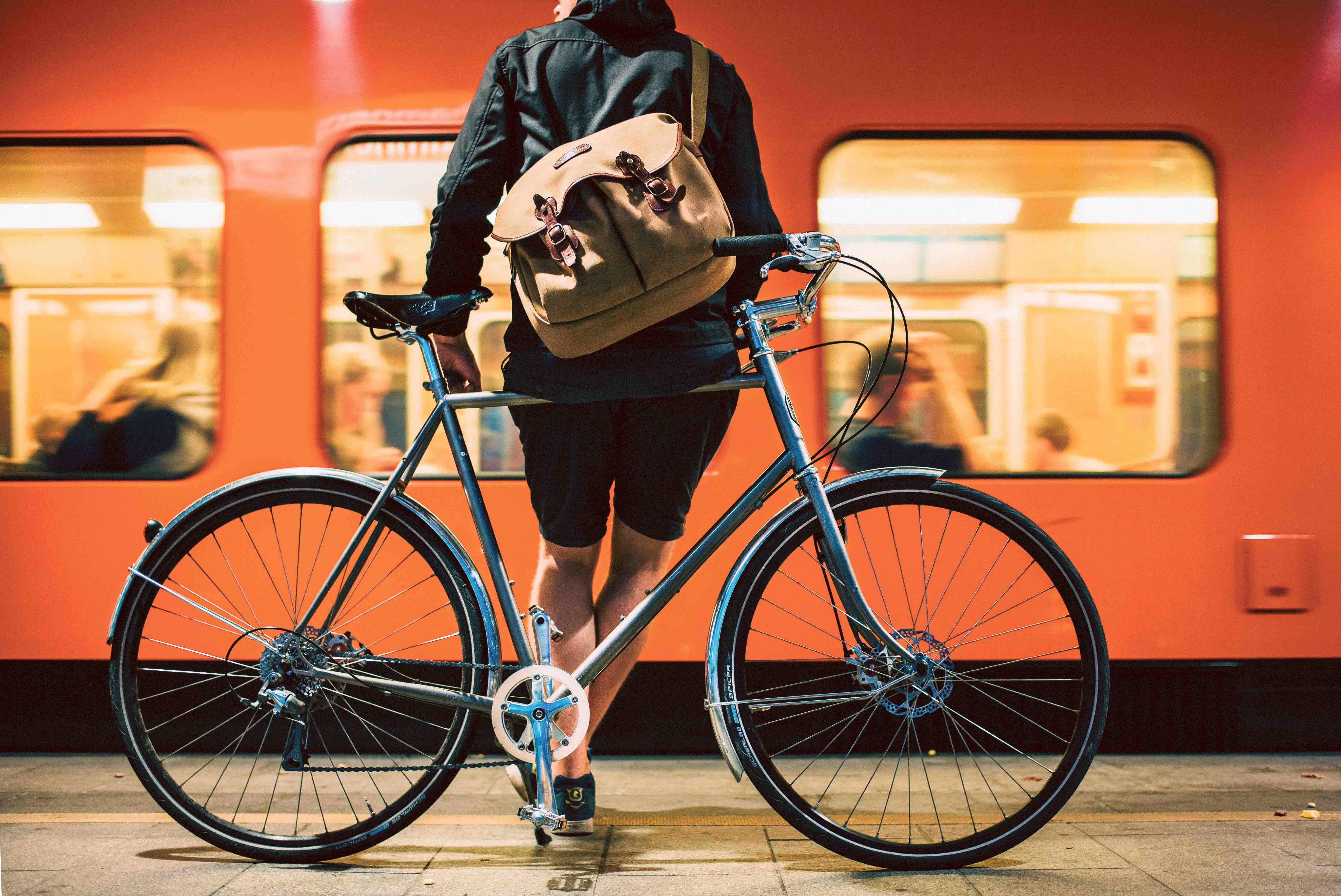 a cyclist waits for a metro at a metro station
