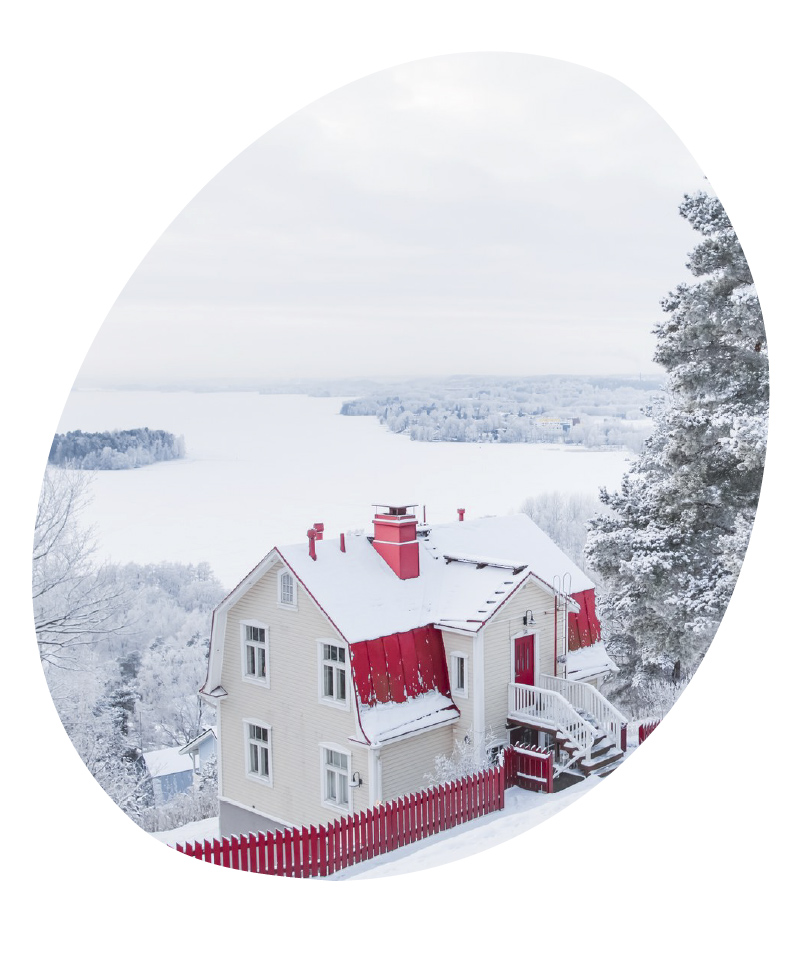 A white and red wooden house at Pispala neighbourhood in snowy Tampere. - Visit Tampere, Laura Vanzo