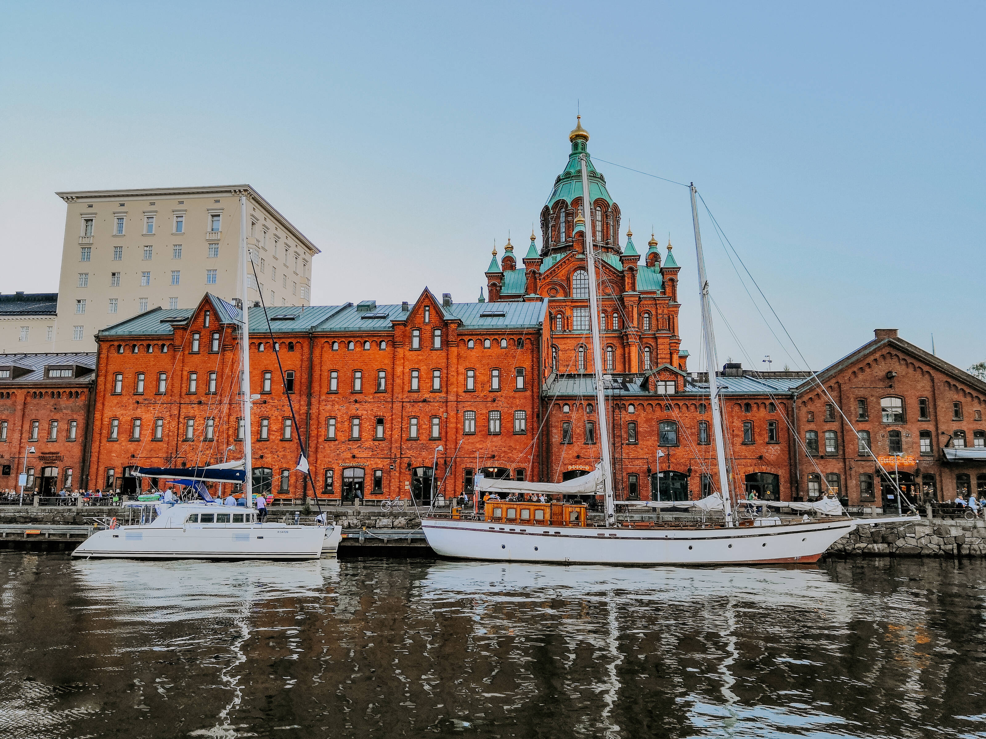 Red brick buildings and church by the water