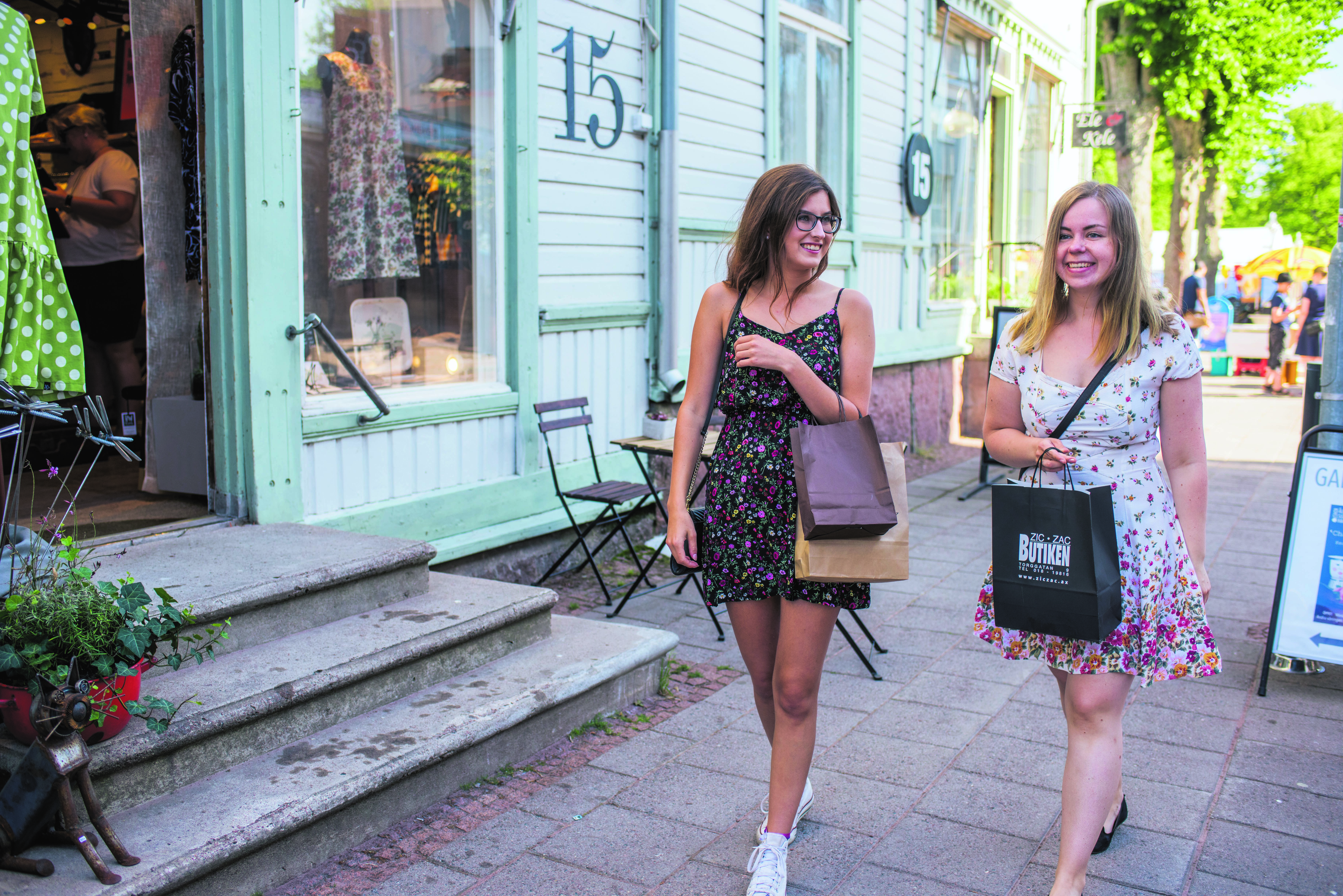 Two women walk on Mariehamn's shopping street in Åland