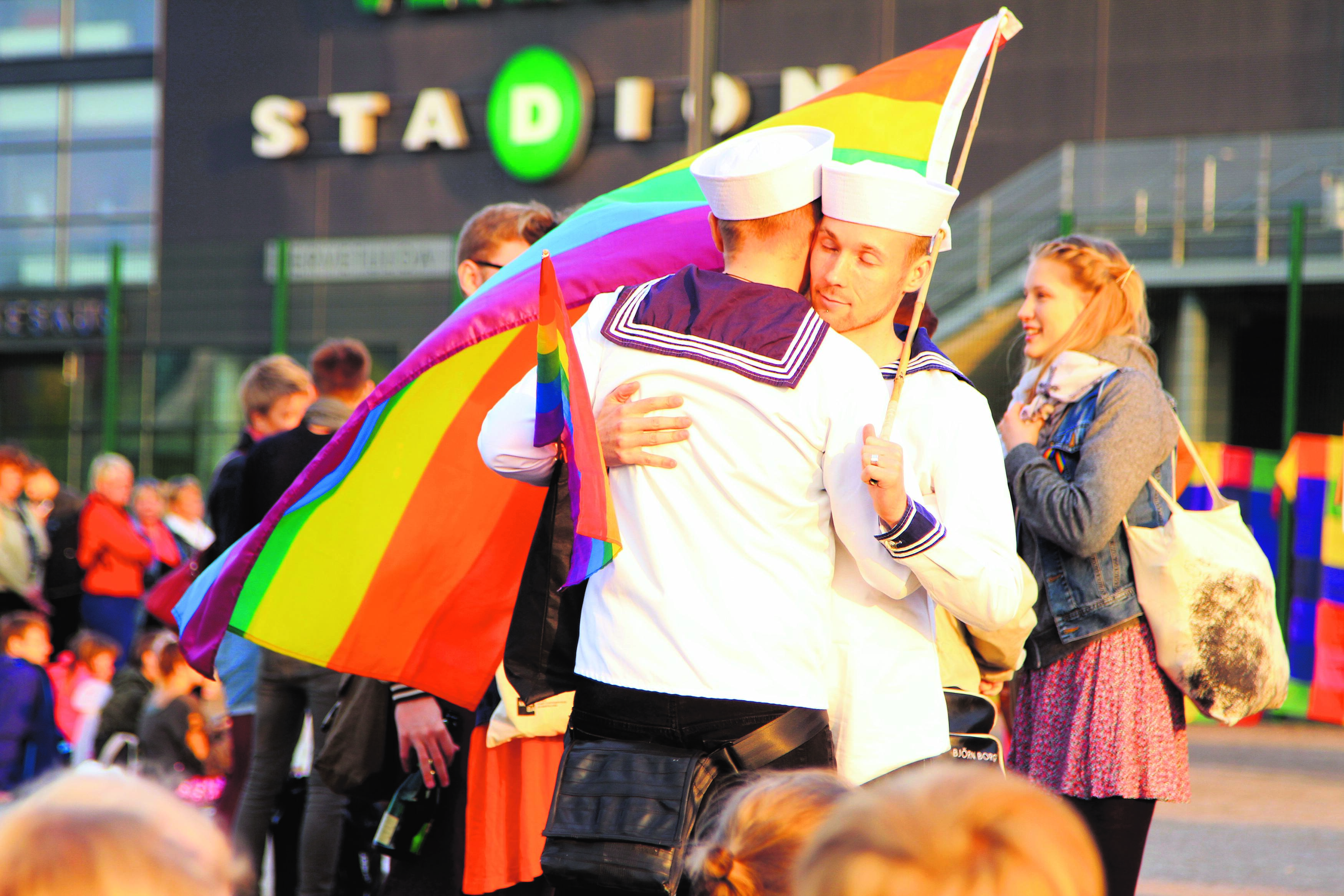 Two men hugging during a pride event in Turku, Finland